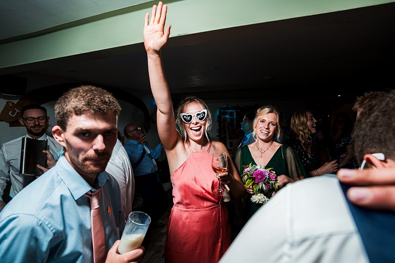 People dancing at a lively party celebration.