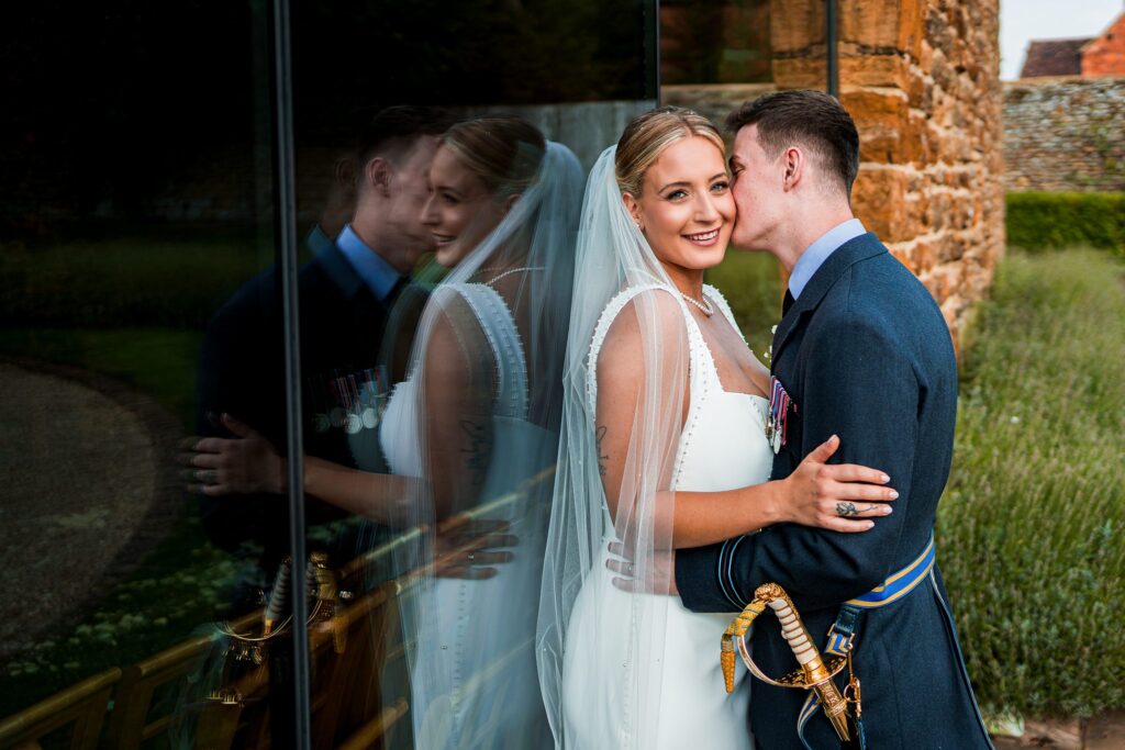 Bride and groom embrace on wedding day