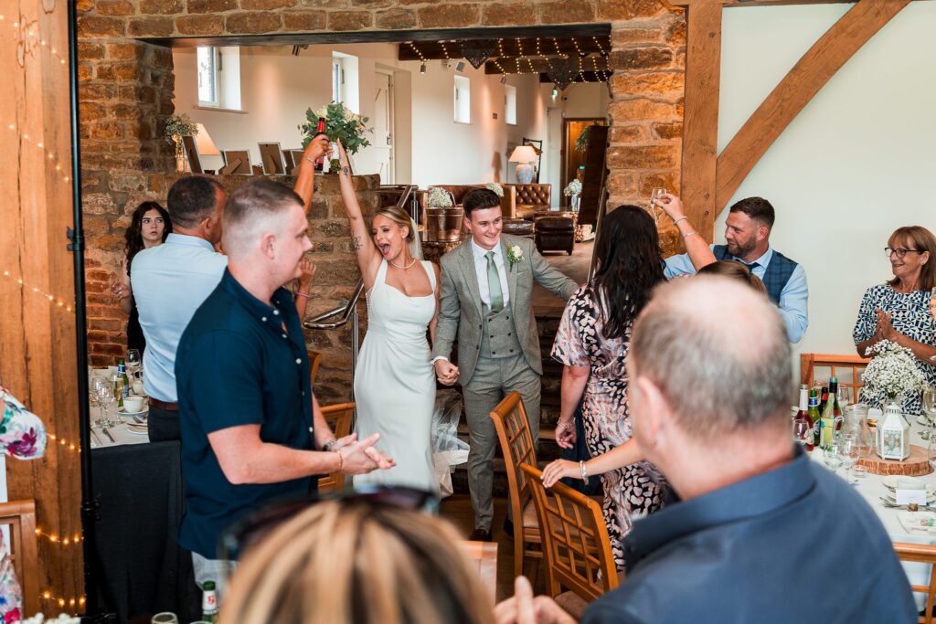 Wedding celebration with happy couple and guests.