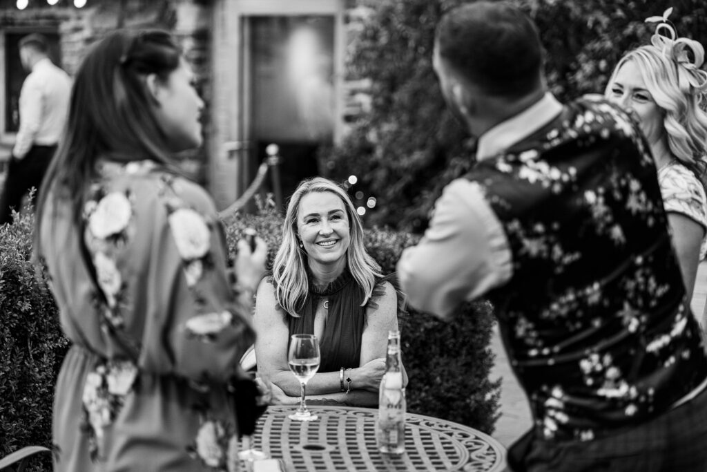 Group of friends smiling at garden party.