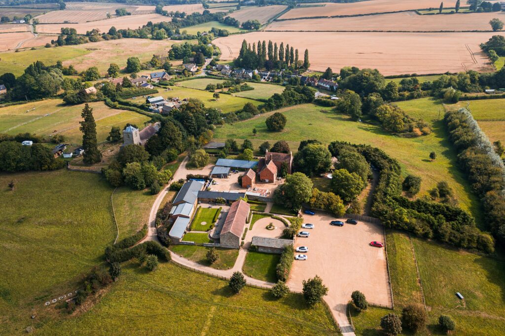Aerial view of countryside and buildings in England.