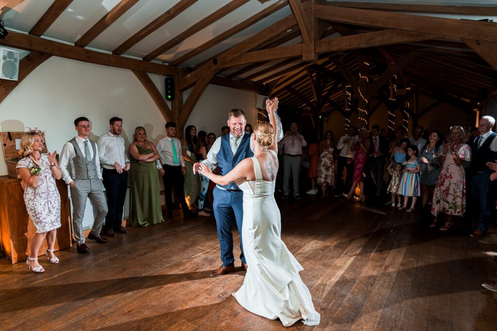 Bride and groom dancing at wedding reception.