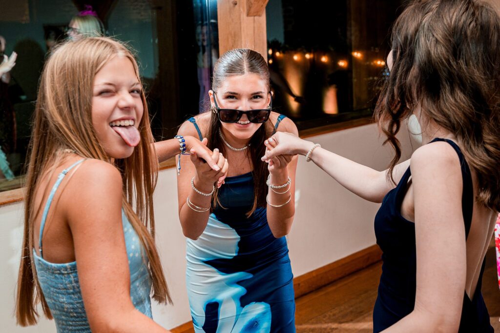 Three young women having fun at a party