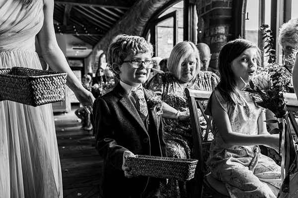 Children holding baskets at a wedding ceremony.