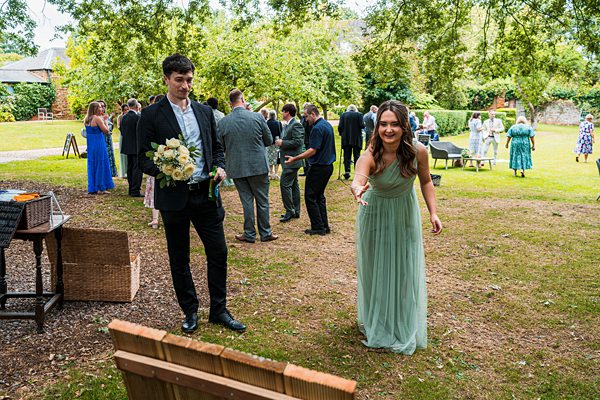 Guests playing outdoor games at a garden party.