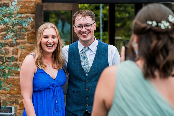 Smiling couple posing for a photo at event.