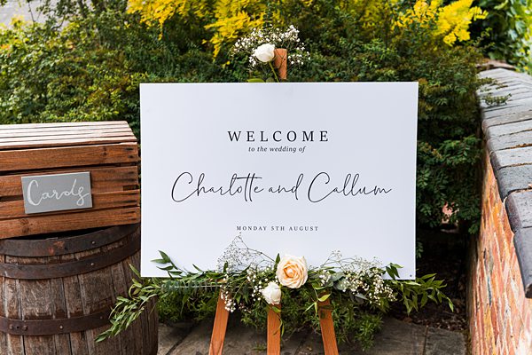 Wedding welcome sign with floral decoration
