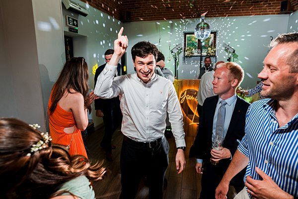 People dancing and enjoying a lively party.