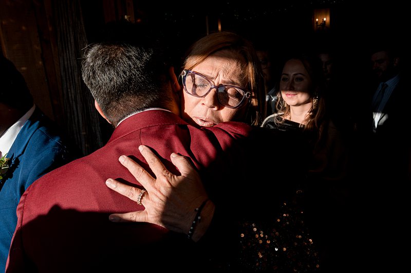 Emotional hug at a social gathering