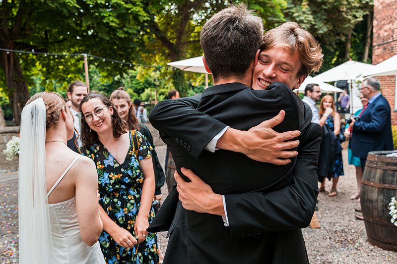 Guests celebrating at outdoor wedding reception