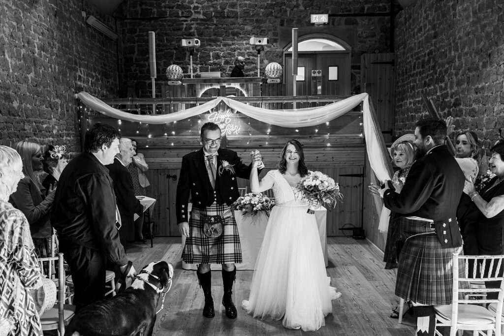 Bride and groom celebrate their wedding ceremony.