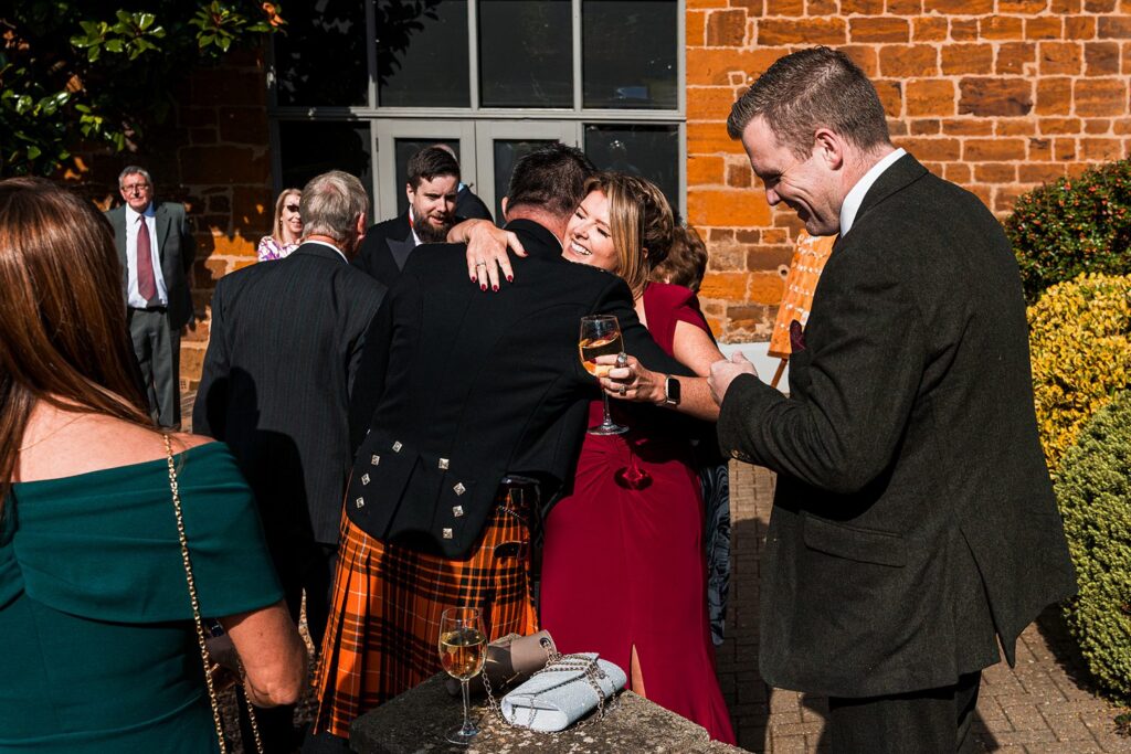 Guests greeting at outdoor formal event
