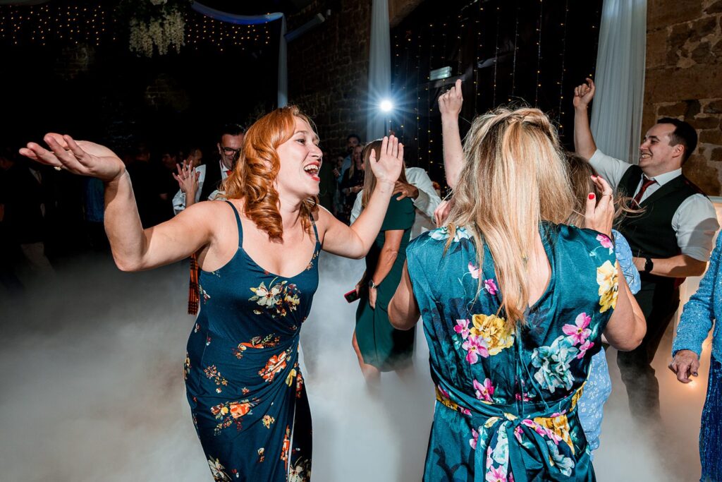 People dancing joyfully at a vibrant party.