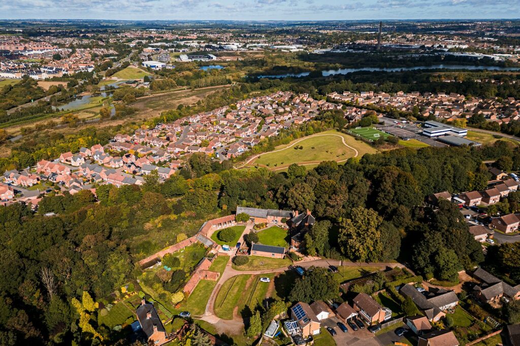 Aerial view of houses and landscape.