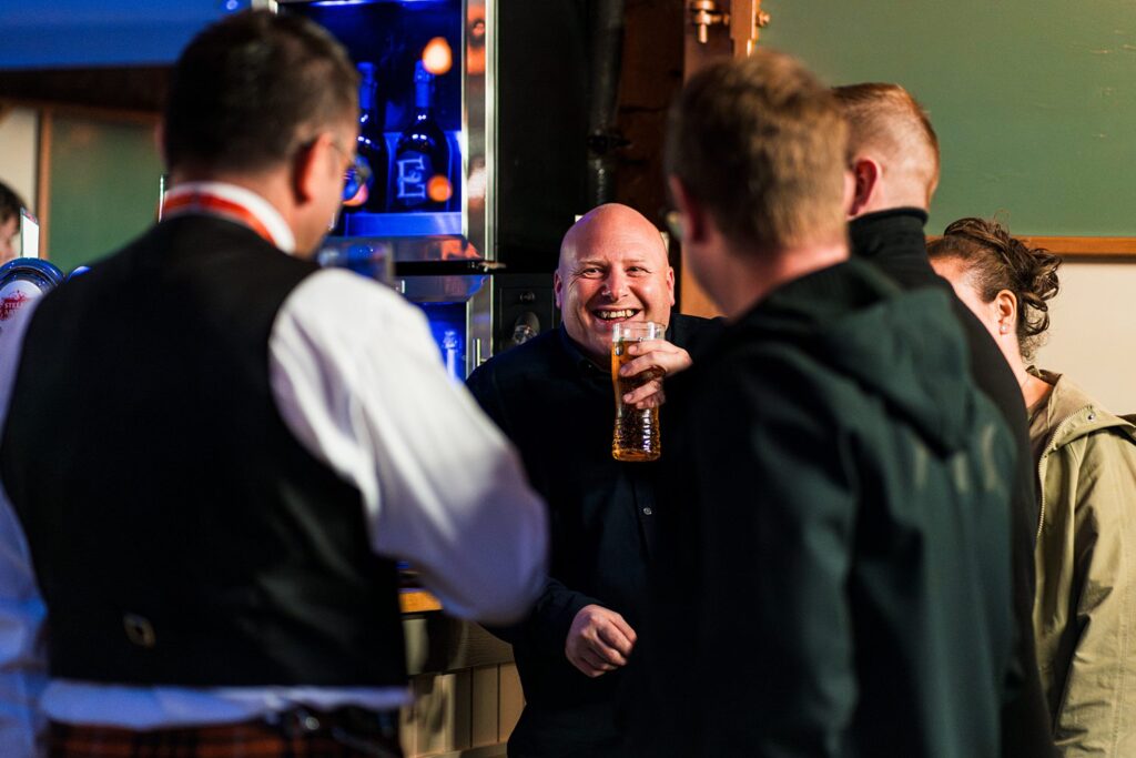Happy friends enjoying drinks at a bar