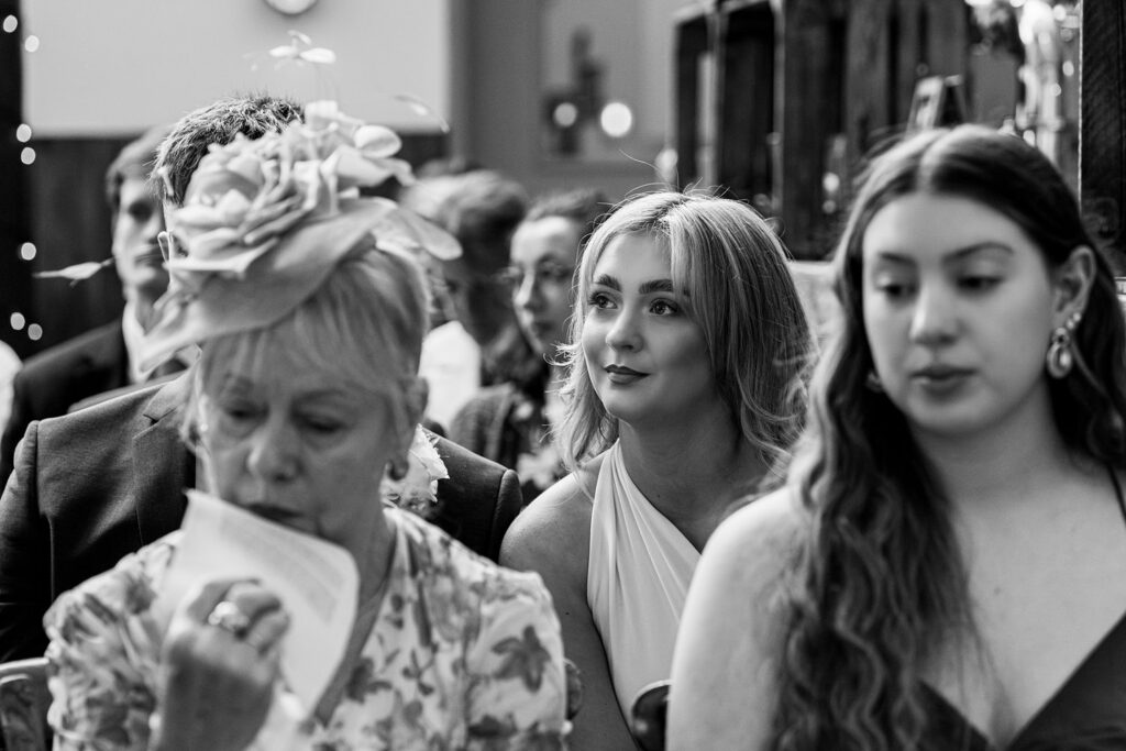 People sitting attentively at a formal event