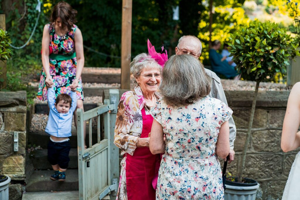 People enjoying outdoors at a garden gathering