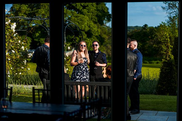 People enjoying a garden party in sunlight.