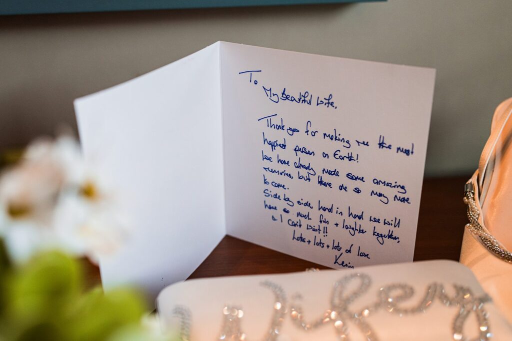 Open card with handwritten message to wife.