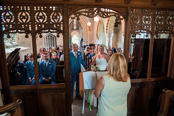 Bride and groom during church wedding ceremony.