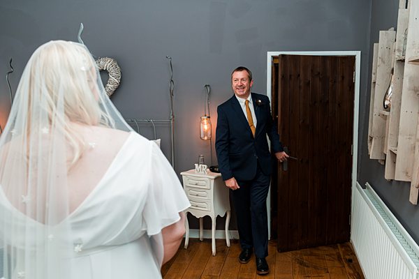 Man entering room, bride in foreground