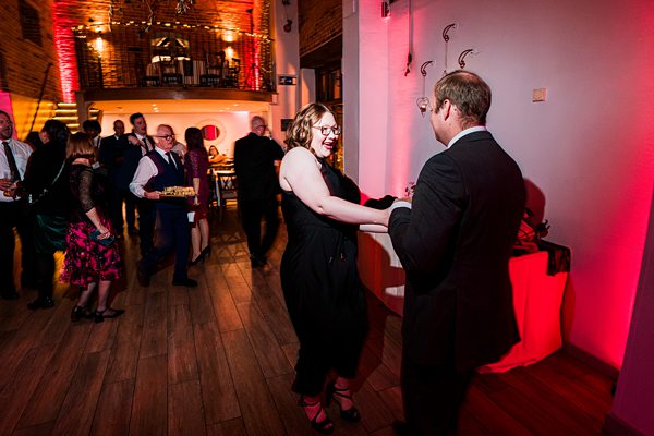 Guests dancing at a lively indoor event