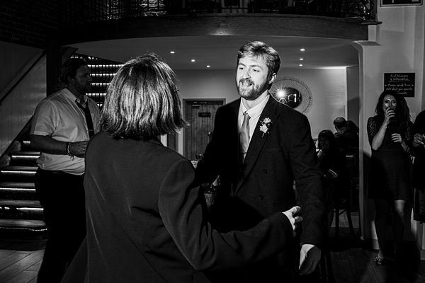 Two people dancing at an event.