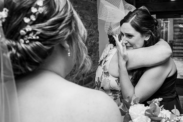 Emotional wedding hug and tears of joy