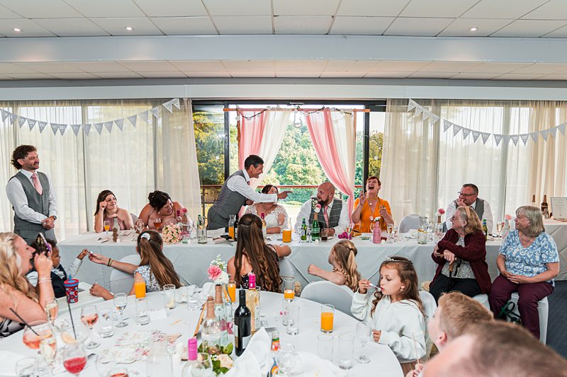 Wedding reception with guests and speeches.