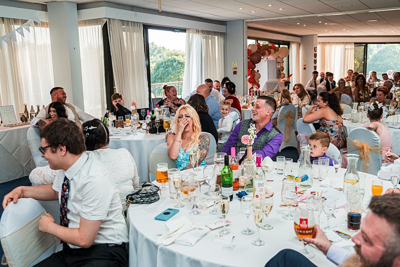 Guests enjoying a lively wedding reception.