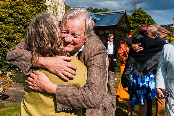 People embracing at an outdoor event