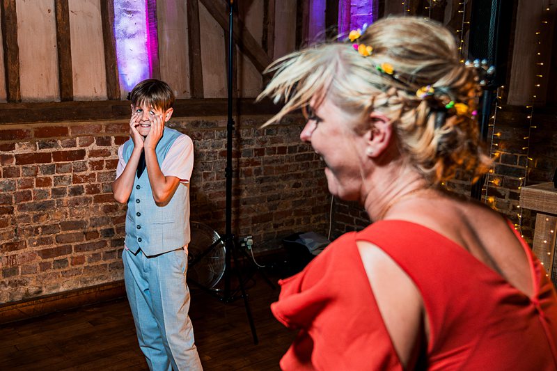 Boy surprised by woman at lively event