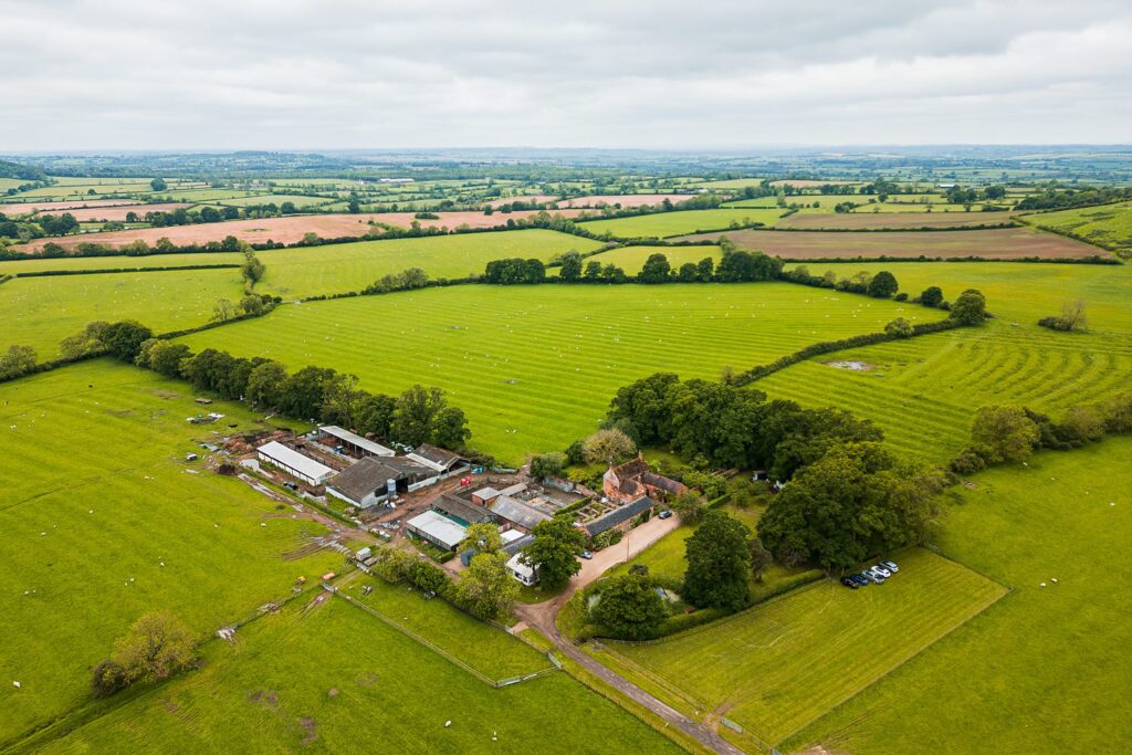 Aerial view of English countryside farm landscape.