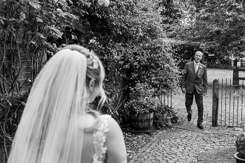 Bride sees father for first time at wedding.