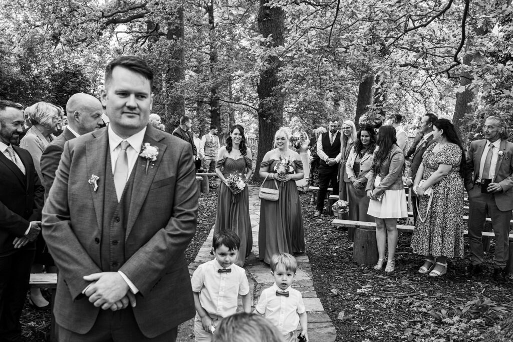 Wedding procession in a forest setting.