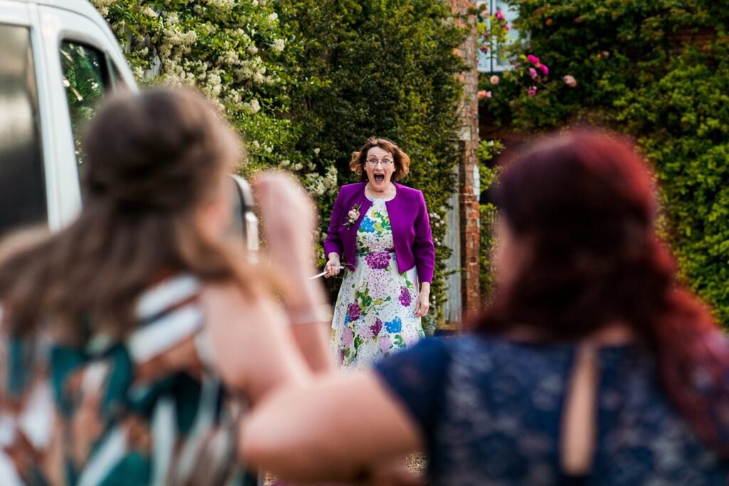 Woman excited and approaching outdoor event.