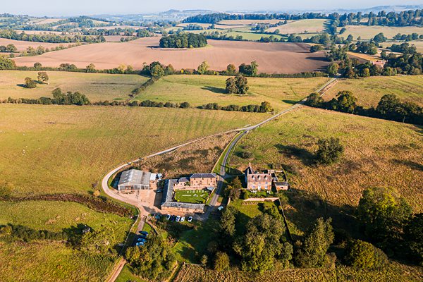 Aerial view of countryside farm and fields.