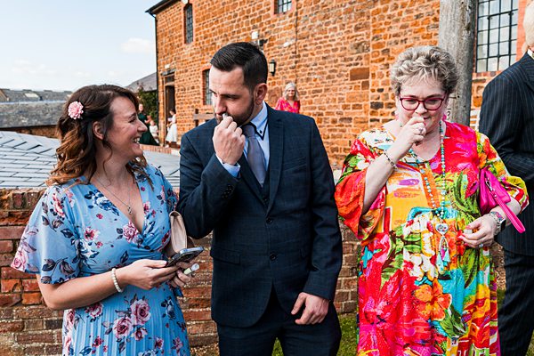 Guests chatting at outdoor wedding reception
