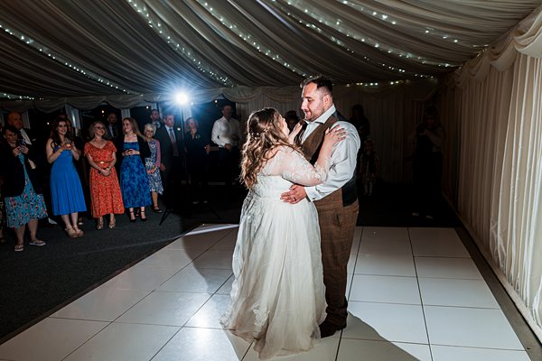 Bride and groom's first dance at wedding reception.