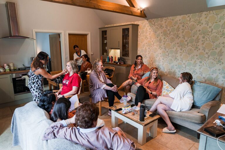 Group of women getting ready in comfortable room.