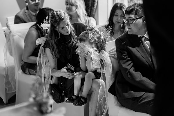 Guests seated at a wedding ceremony.