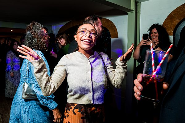 People enjoying a lively party atmosphere indoors.