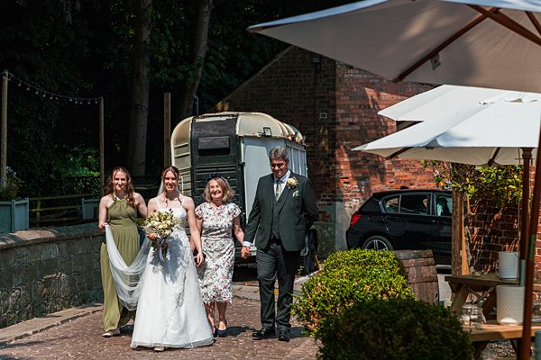 Bride with family walking outdoors