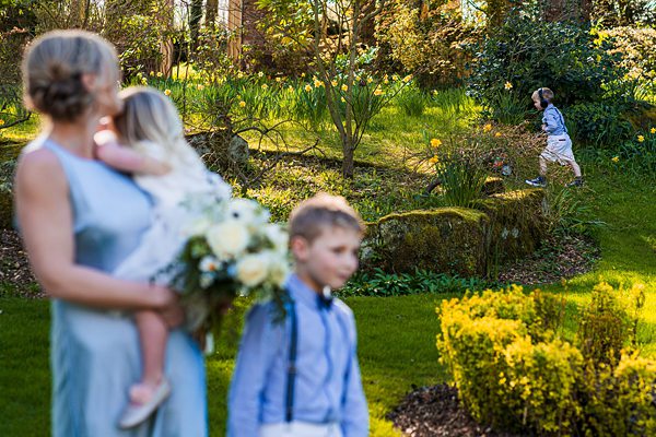 Children playing in a sunny garden.