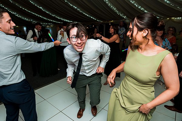 People dancing joyfully at a party event.