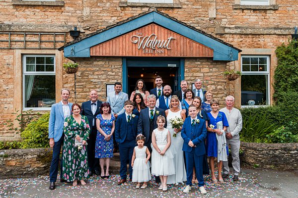 Wedding group outside The Walnut Tree Inn.