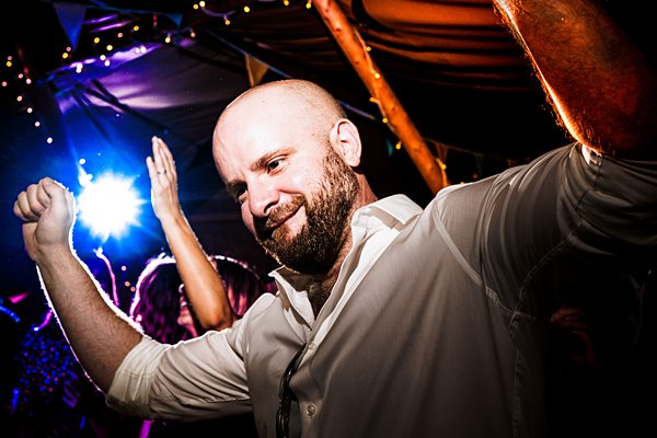 Man dancing joyfully at lively party.