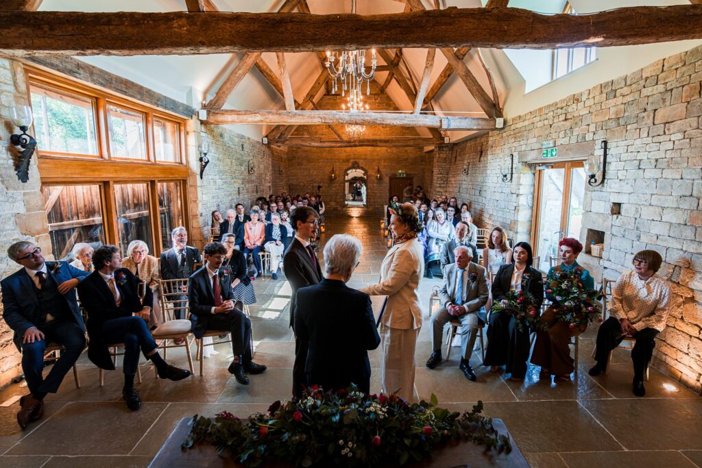 Wedding ceremony in rustic barn setting